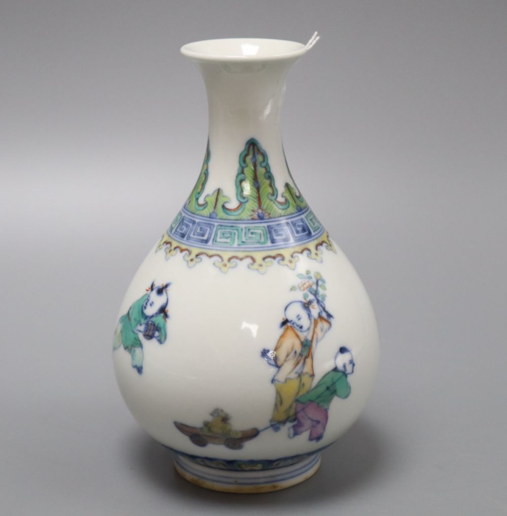 A Chinese doucai figurative bottle vase, bears Yongzheng mark, height 17cm